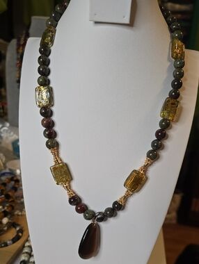 Green and Brown Beaded Necklace with Gold Accents and Brown Teardrop Pendant